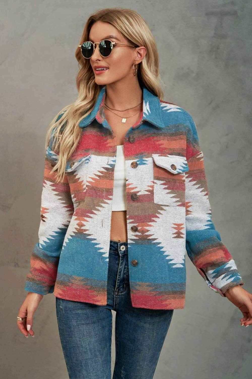 woman wearing blue and red print collared neck shacket with geometric pattern and sunglasses