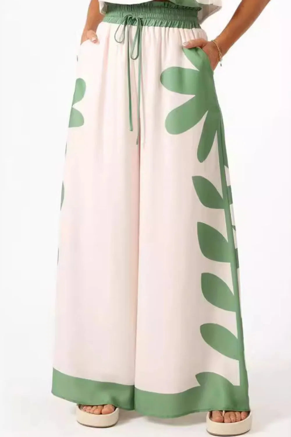 Wide-leg pants with green leaf print and drawstring waist, part of leaf print tank top and pants set
