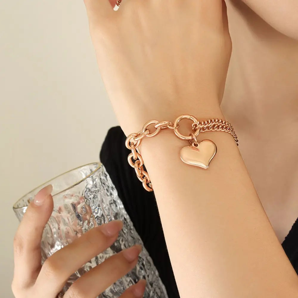 Rose gold half chunky chain titanium steel bracelet with heart charm on wrist