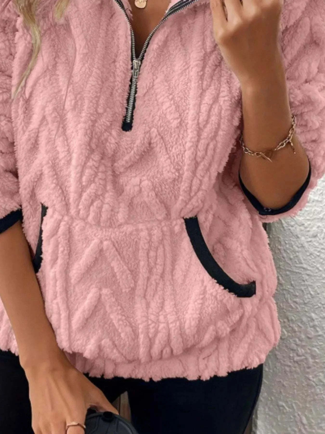 Plus size pink full size sherpa half zip sweatshirt with black trimmed pockets and sleeves