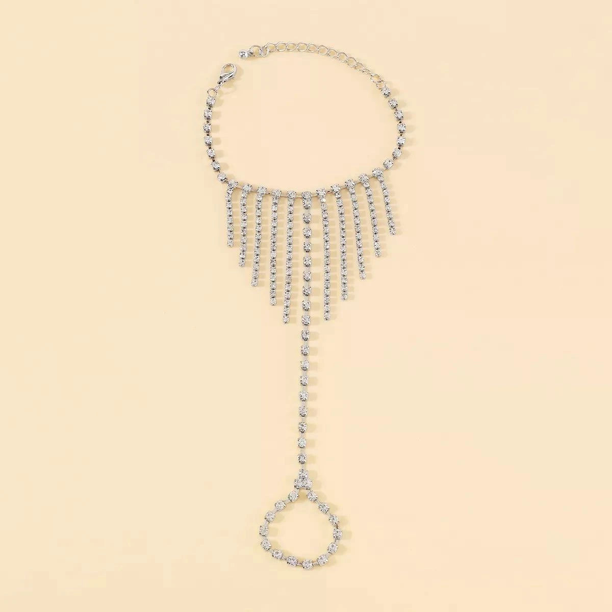Rhinestone Fringe Hand Chain BraceletPieces:1-piece
Material:18K Gold-Plated,Iron,Rhinestone,Silver-plated
Care instructions:Avoid wearing during exercise, as sweat will react with the jewelry to producRhinestone Fringe Hand Chain