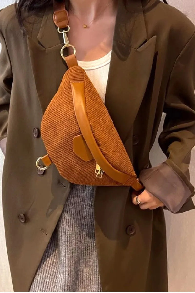 Brown corduroy crossbody bag with removable adjustable strap worn over a casual outfit