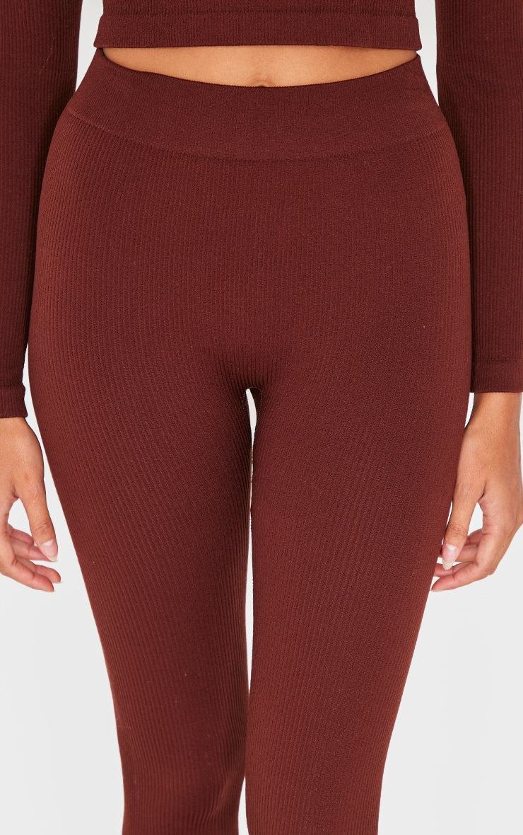 Close-up of black structured contour ribbed leggings showing textured knit and fitted silhouette