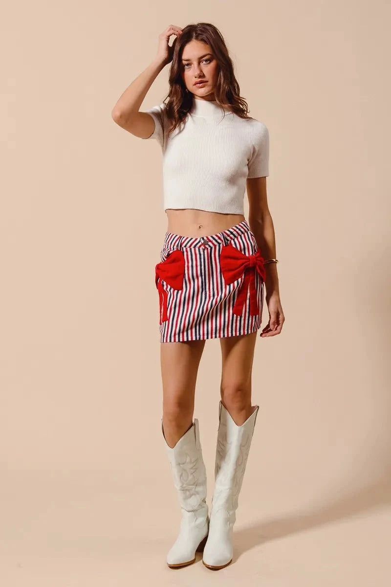 SO ME Contrast Bow Knot Pocket Fourth Of July Denim SkirtThis stylish striped denim mini skirt features a charming nautical-inspired design with bold red and white vertical stripes. Crafted from lightweight denim material,Redemption By Ashley NorthContrast Bow Knot