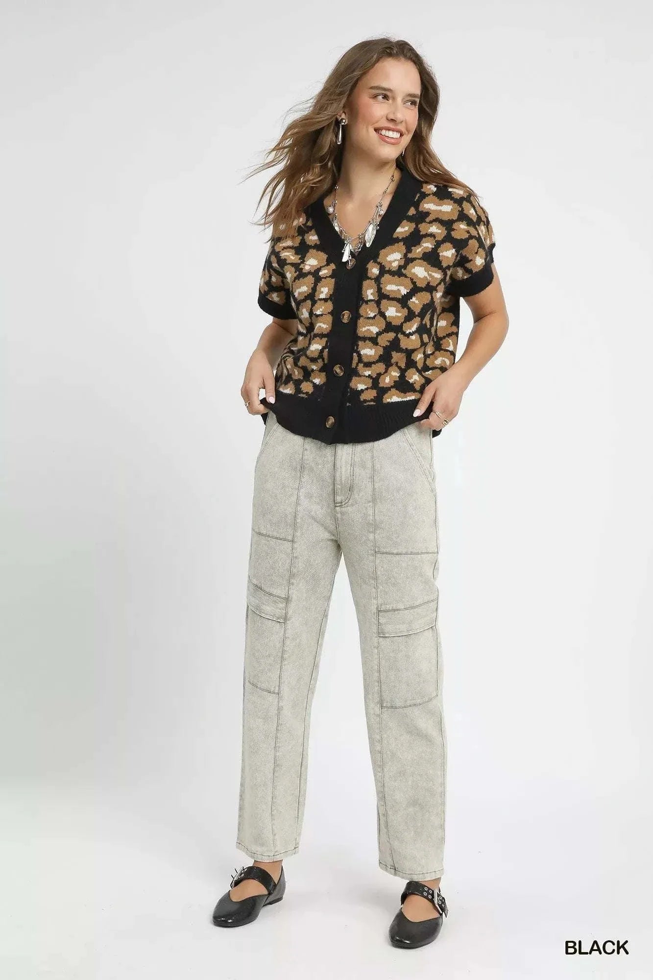 Umgee Leopard Button Down Short Sleeve CardiganThis stylish leopard print cardigan combines comfort and fashion with its eye-catching animal print pattern and classic button-up design. Made from soft knit materiaRedemption By Ashley NorthUmgee Leopard Button Down
