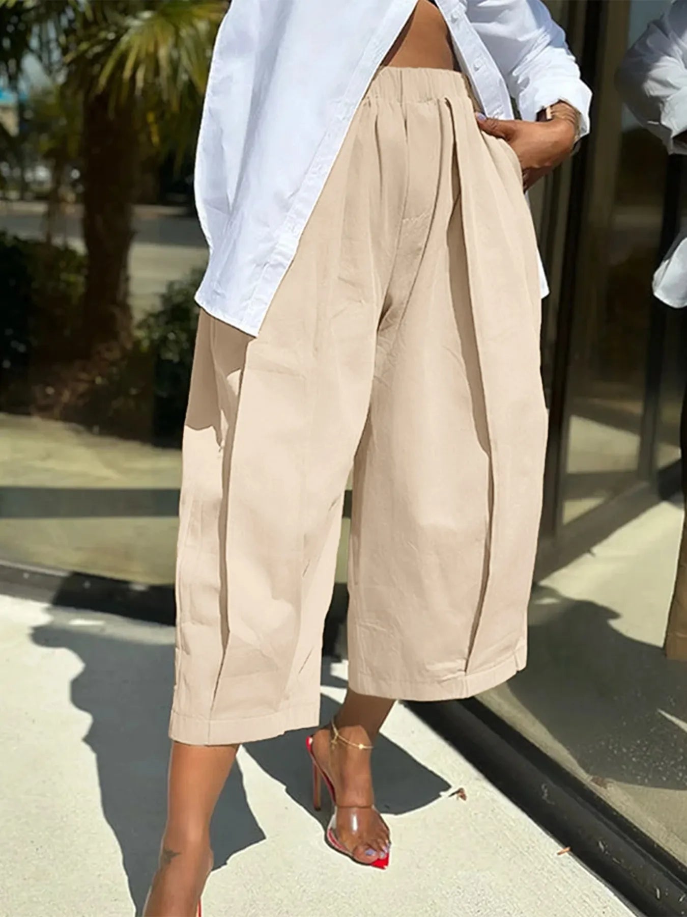 Plus Size Pleated Cropped Pants with Wide Leg Detail.