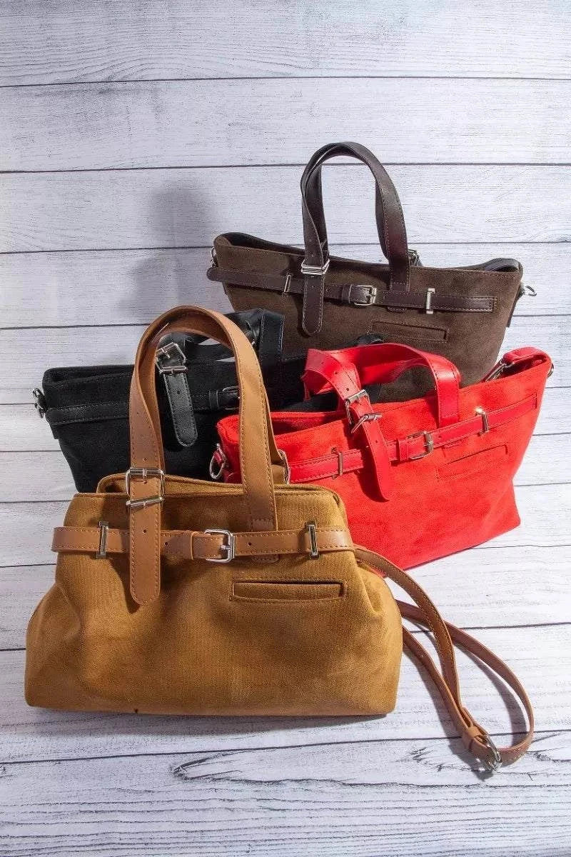 Collection of Fame Faux Leather buckle strap detail tote bags in multiple colors including brown, black, red, and tan on a wooden surface