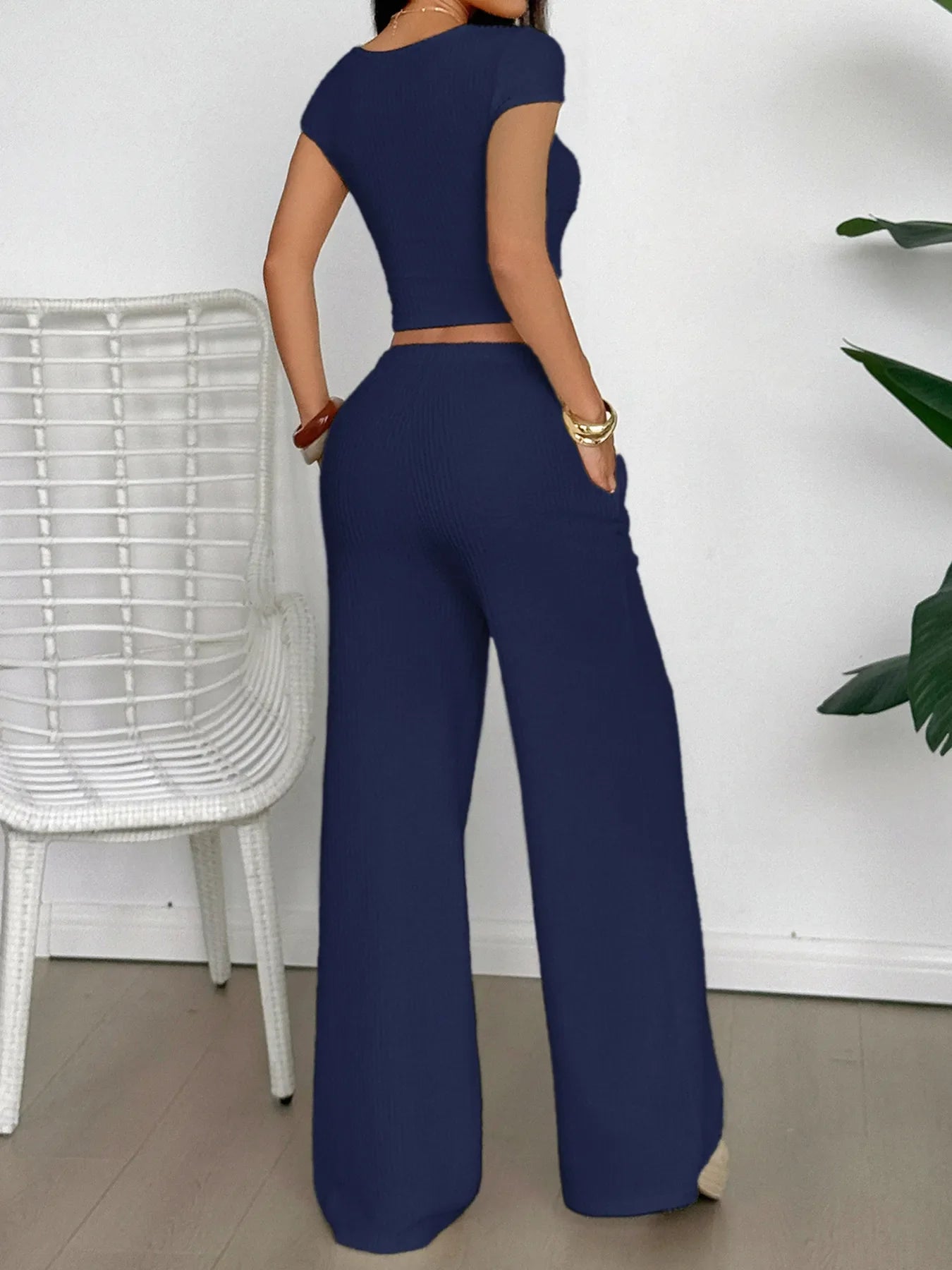 Navy two-piece cutout short sleeve top and pants set with tied crisscross details