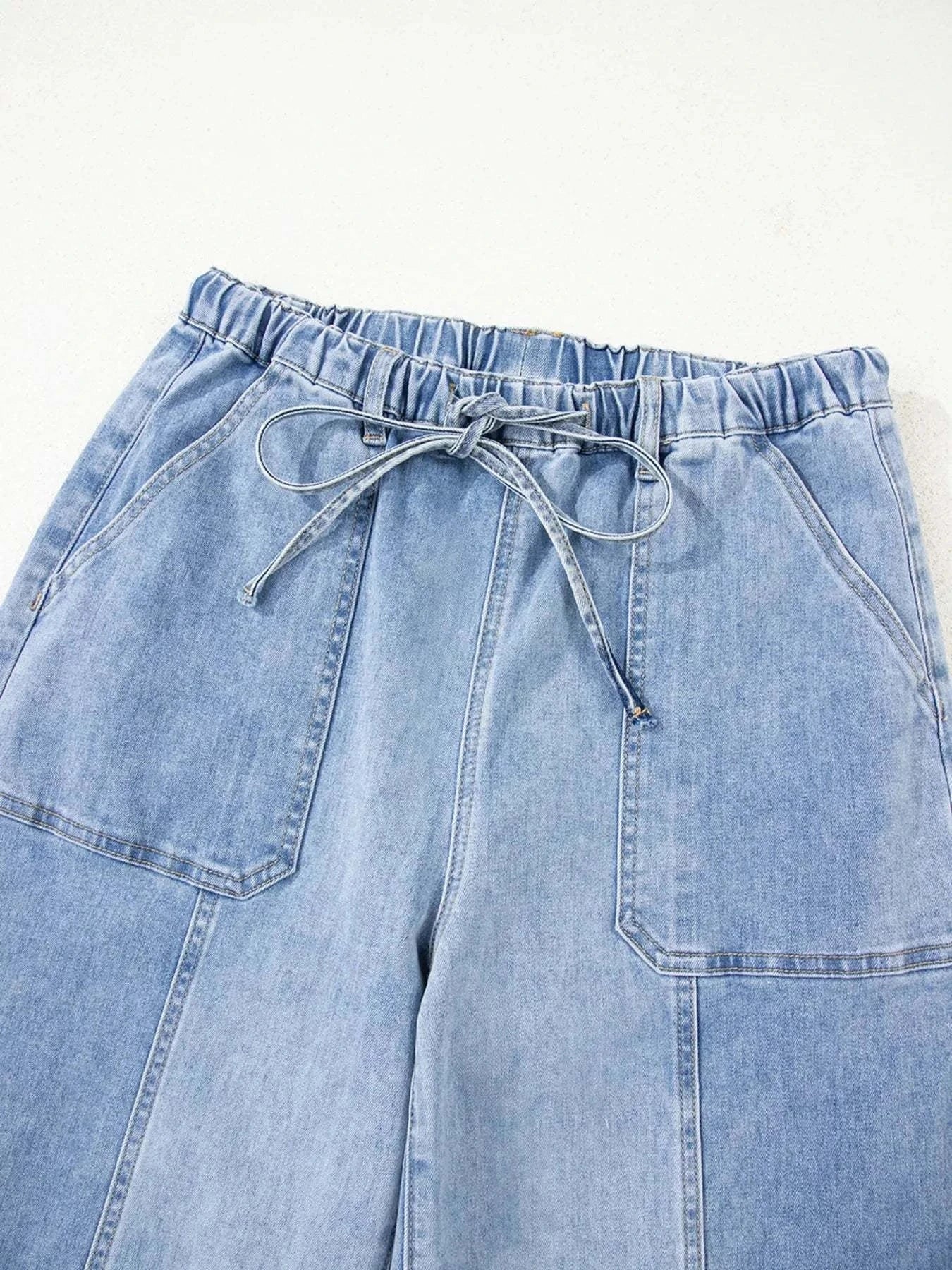 Wide Leg Drawstring Raw Hem JeansFeatures:Pocketed,Drawstring
Stretch:Slightly stretchy
Material composition:75% cotton, 23% polyester, 2% elastane
Care instructions:Machine wash cold. Tumble dry loRedemption By Ashley NorthWide Leg Drawstring Jeans