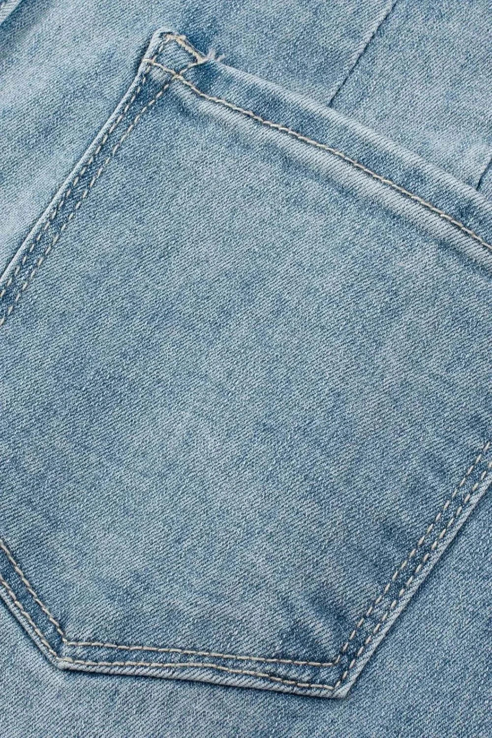 Close-up of light blue denim pocket on Button Fly High Waist Jeans showcasing fabric texture and stitching detail