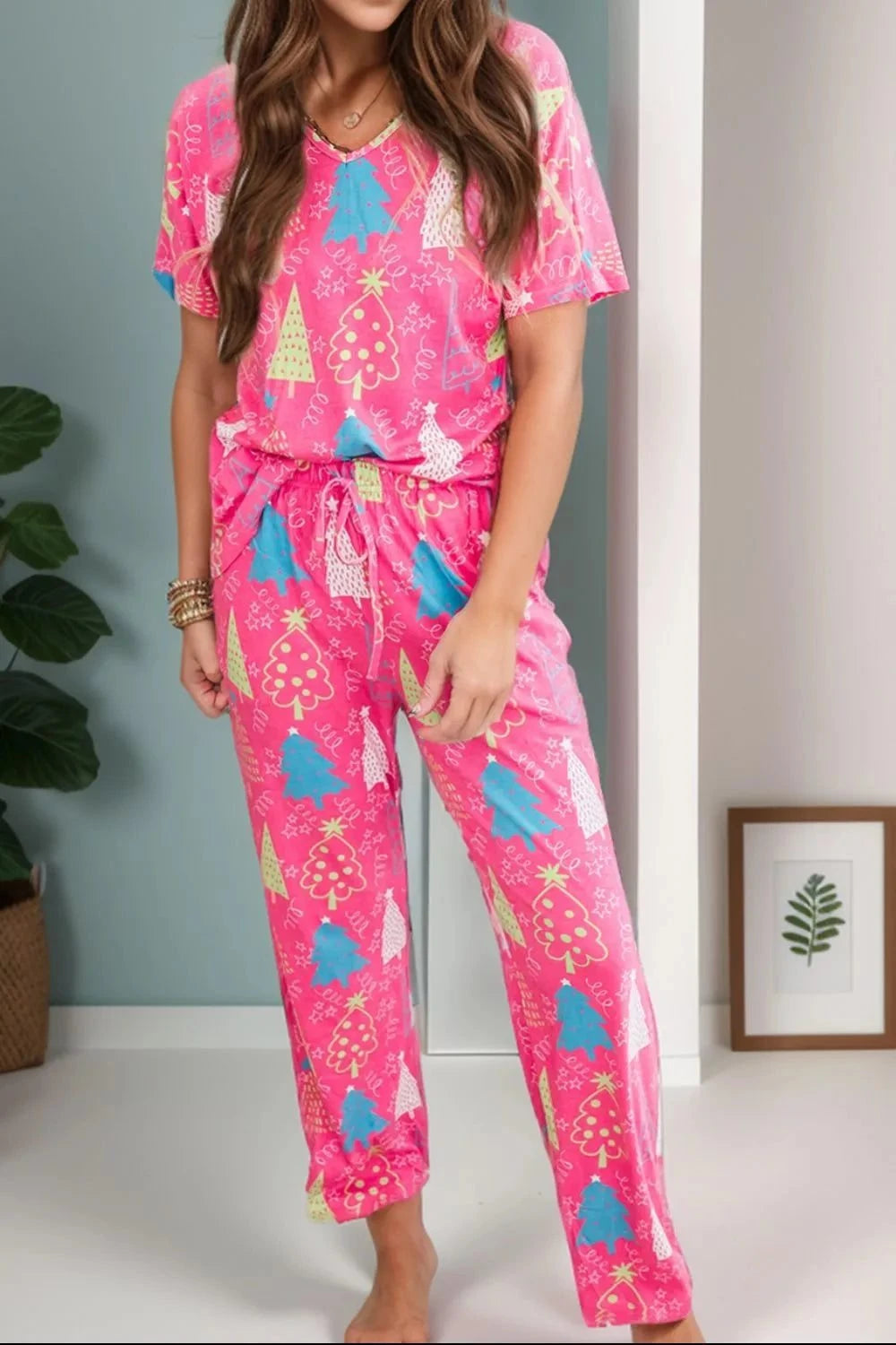 printed v-neck short sleeve top and pants lounge set in pink with festive tree pattern and drawstring waist