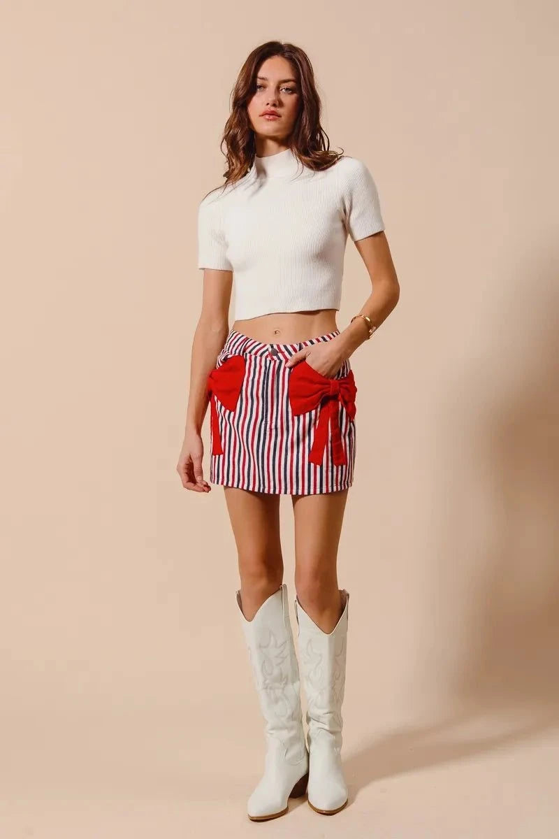 SO ME Contrast Bow Knot Pocket Fourth Of July Denim SkirtThis stylish striped denim mini skirt features a charming nautical-inspired design with bold red and white vertical stripes. Crafted from lightweight denim material,Redemption By Ashley NorthContrast Bow Knot
