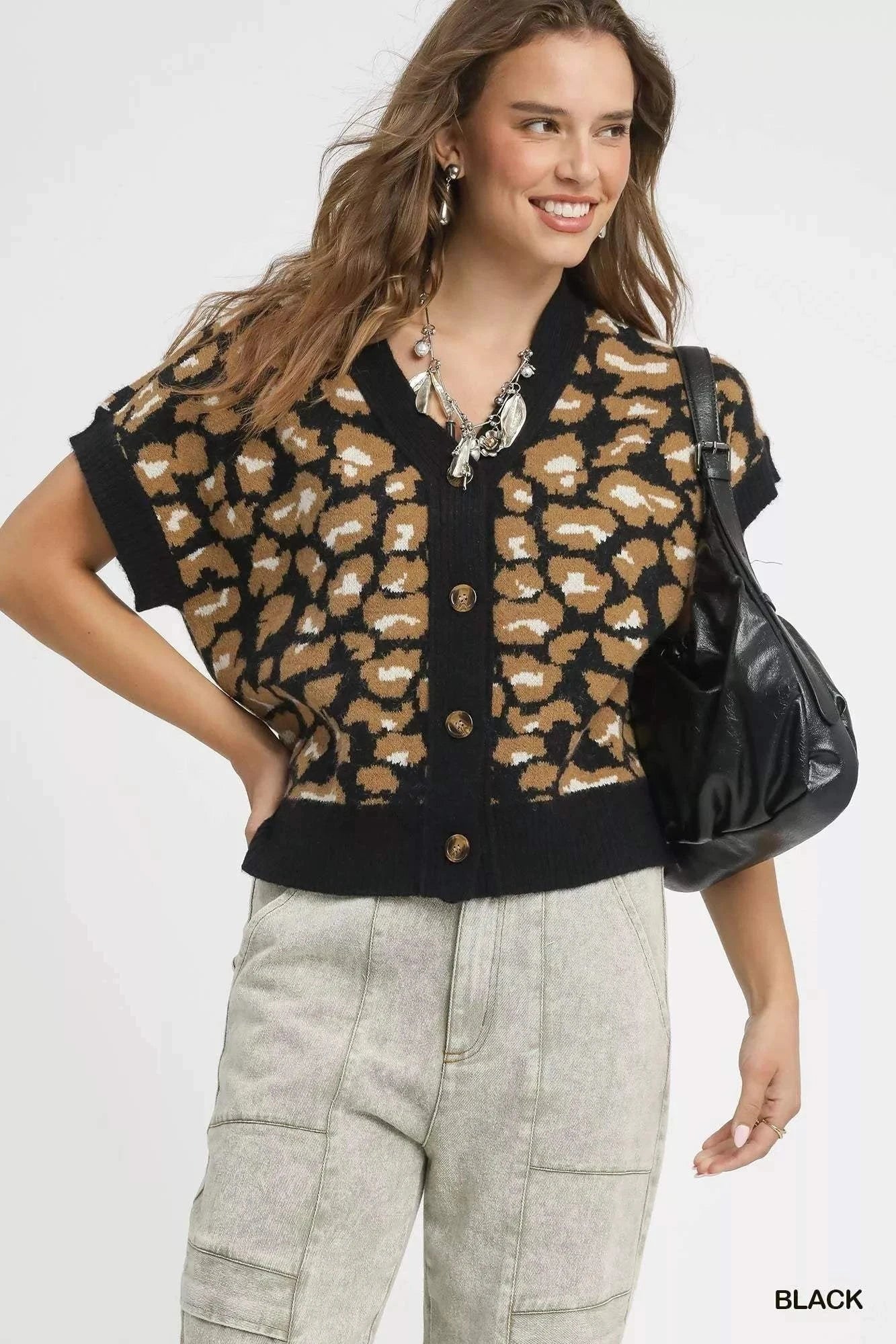 Umgee Leopard Button Down Short Sleeve CardiganThis stylish leopard print cardigan combines comfort and fashion with its eye-catching animal print pattern and classic button-up design. Made from soft knit materiaRedemption By Ashley NorthUmgee Leopard Button Down