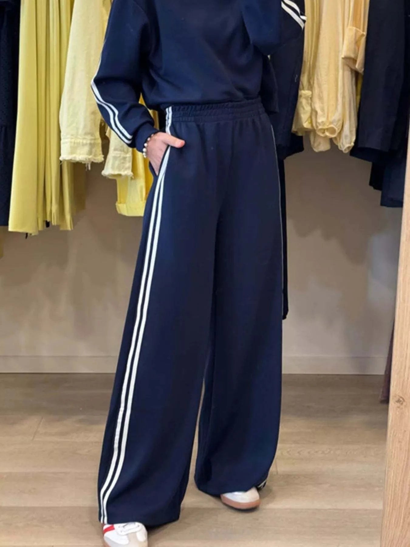 navy blue striped detail crewneck top with matching elastic waist sweatpants two-piece set