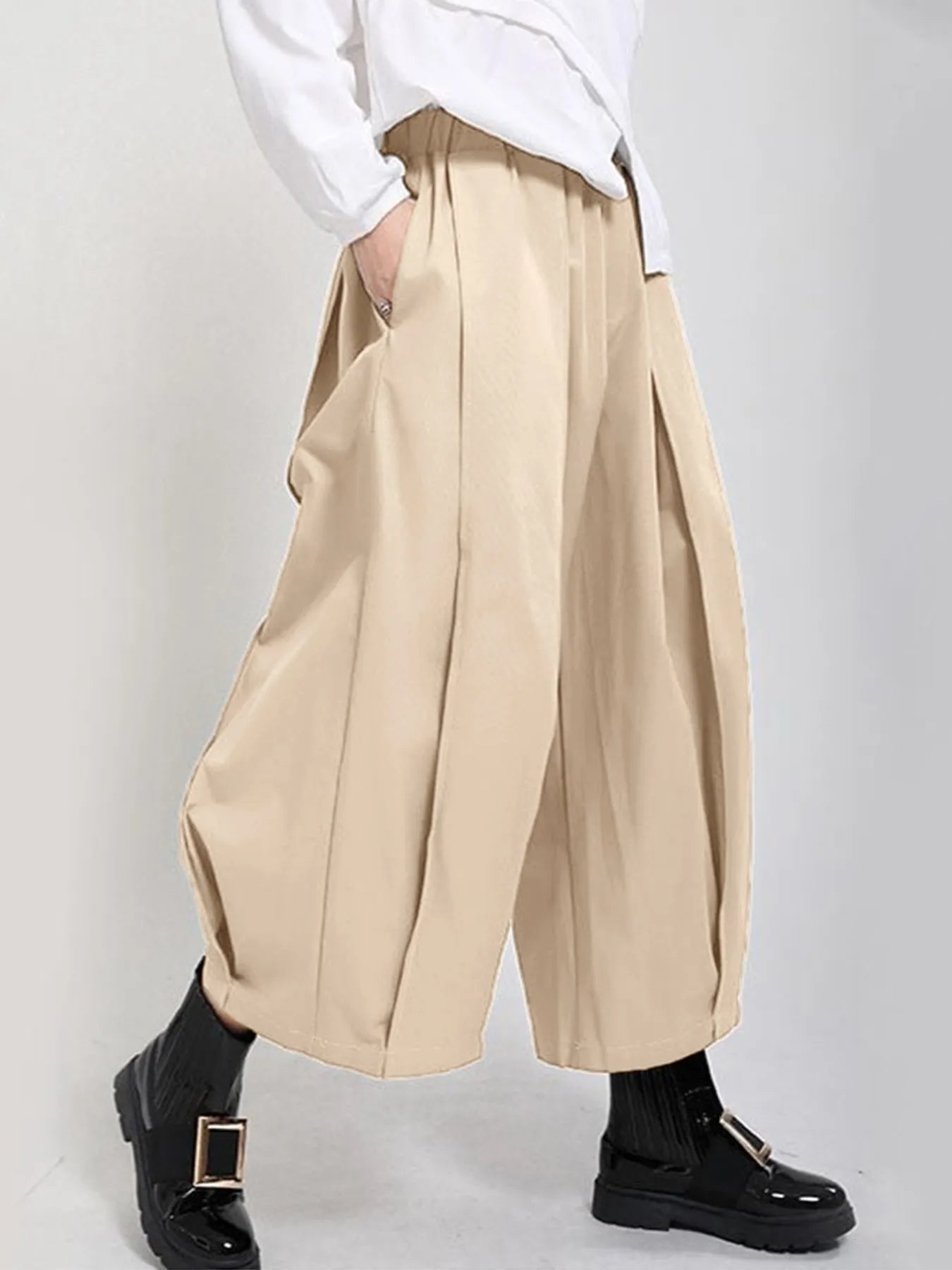 Plus Size Pleated Cropped Pants with Wide Leg Detail.