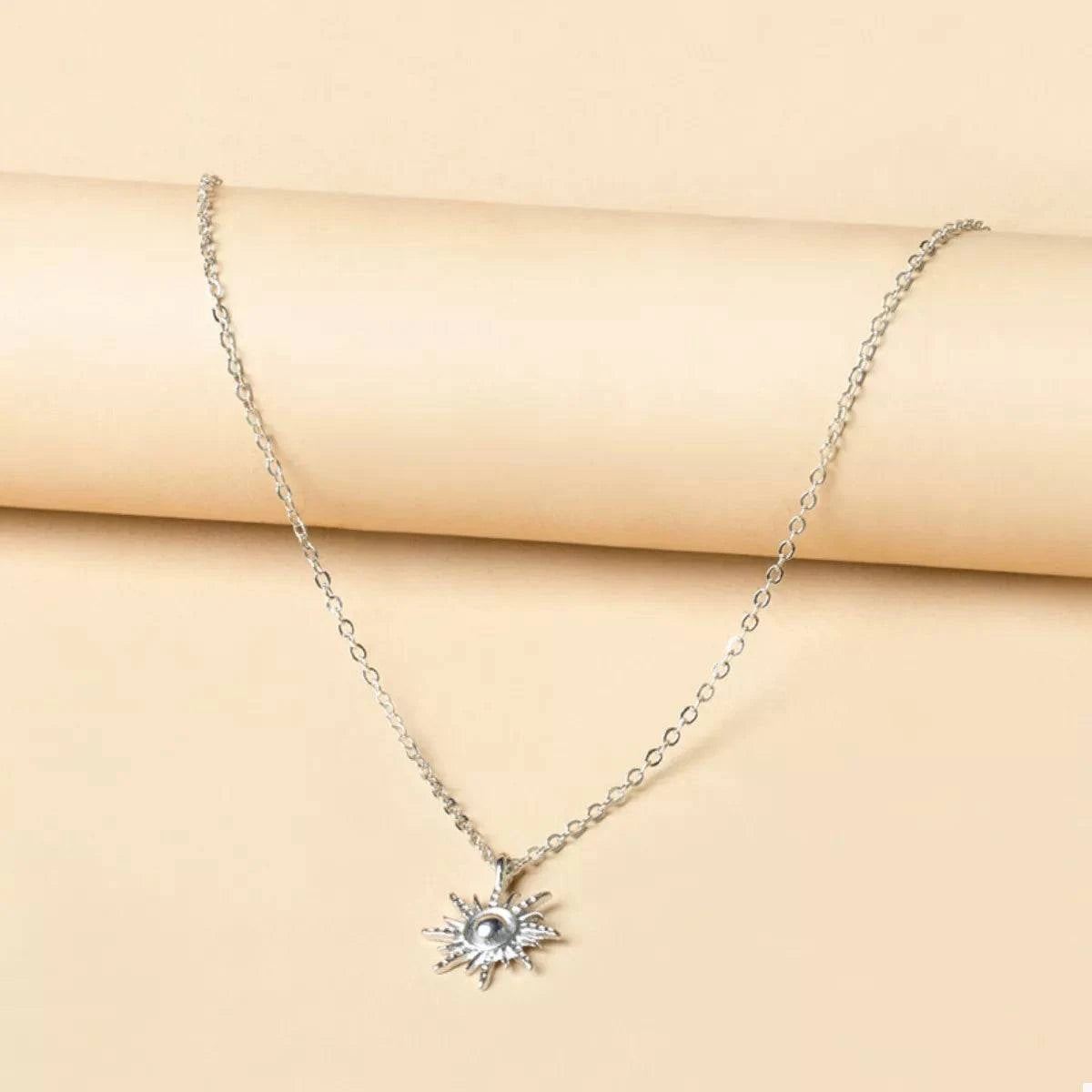 Sunburst Pendant NecklacePieces:1-piece
Material:18K Gold-Plated,Zinc alloy,Silver-plated
Care instructions:Avoid wearing during exercise, as sweat will react with the jewelry to produce silSunburst Pendant Necklace