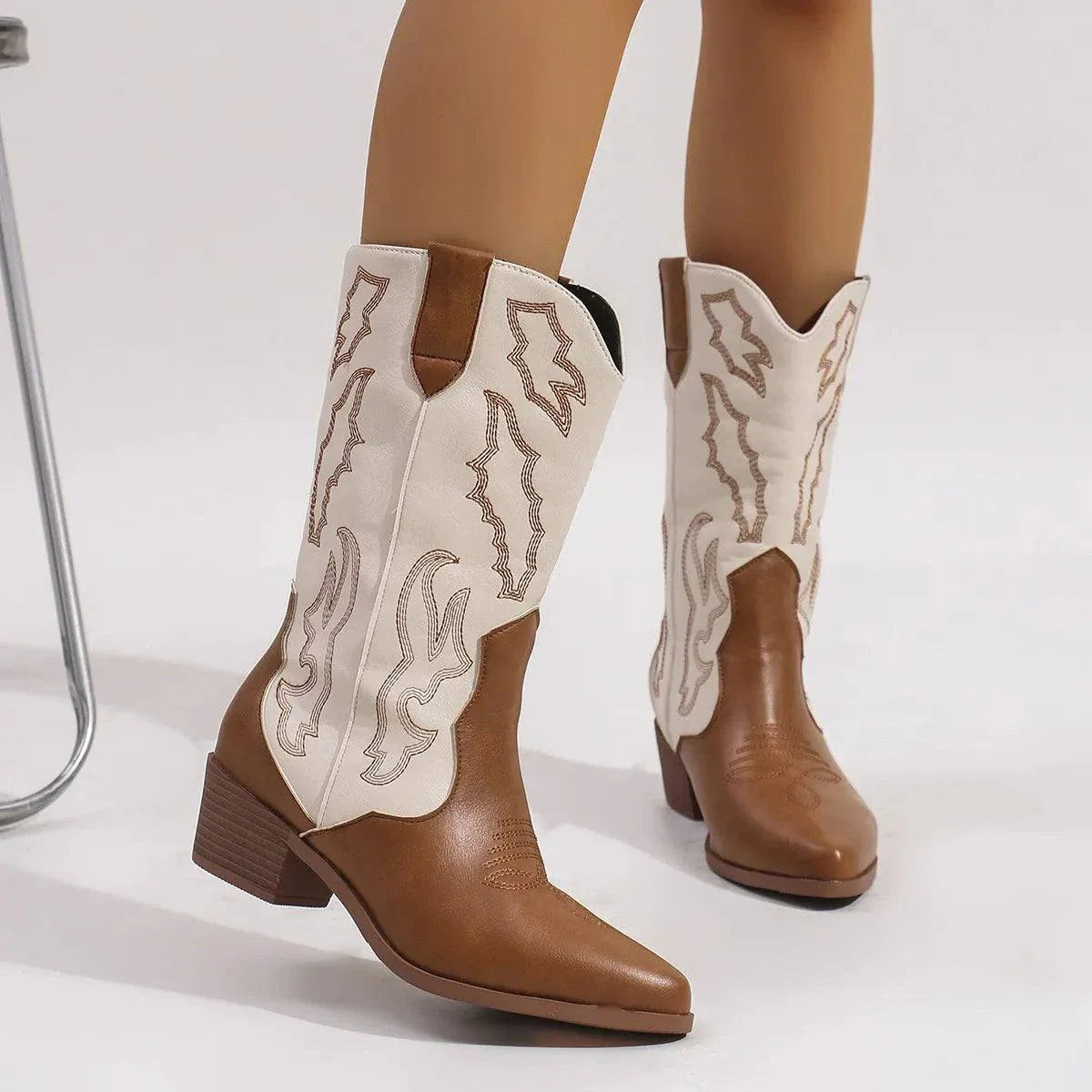 Point toe block heels boots in brown and white PU leather with mid heel and decorative stitching